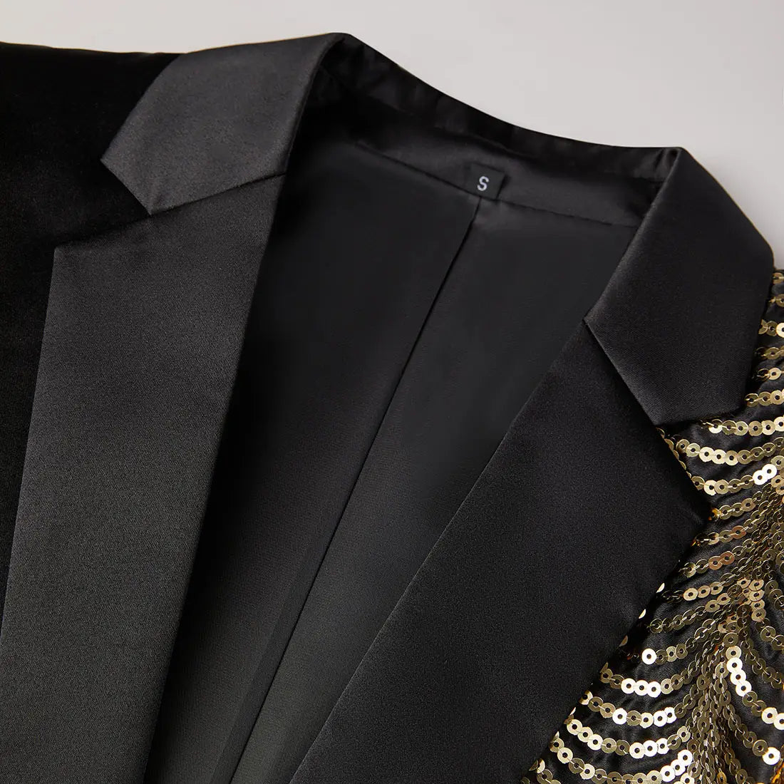 Black satin men’s blazer featuring gold sequin detailing on the shoulder for a sophisticated look.