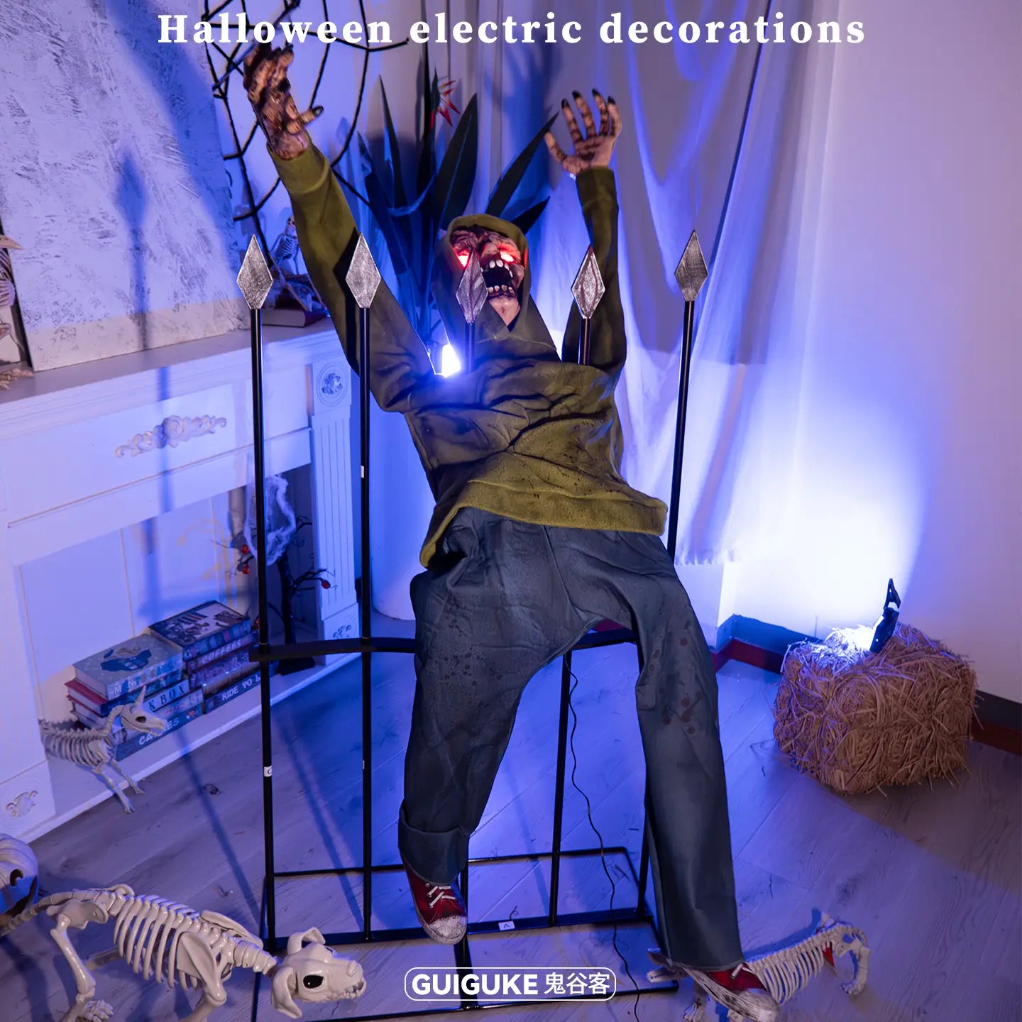 an animated zombie fence breaker halloween decoration featuring a spooky olive green zombie figure with glowing red eyes and a menacing grin sitting on an electric chair surrounded by skeletal animals in a halloween-themed setup