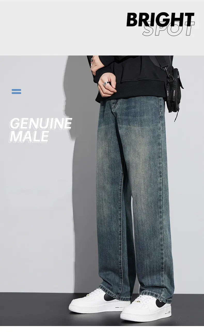 Jeans droits amples doublés de polaire pour homme en denim bleu, avec une coupe droite ample et décontractée.
