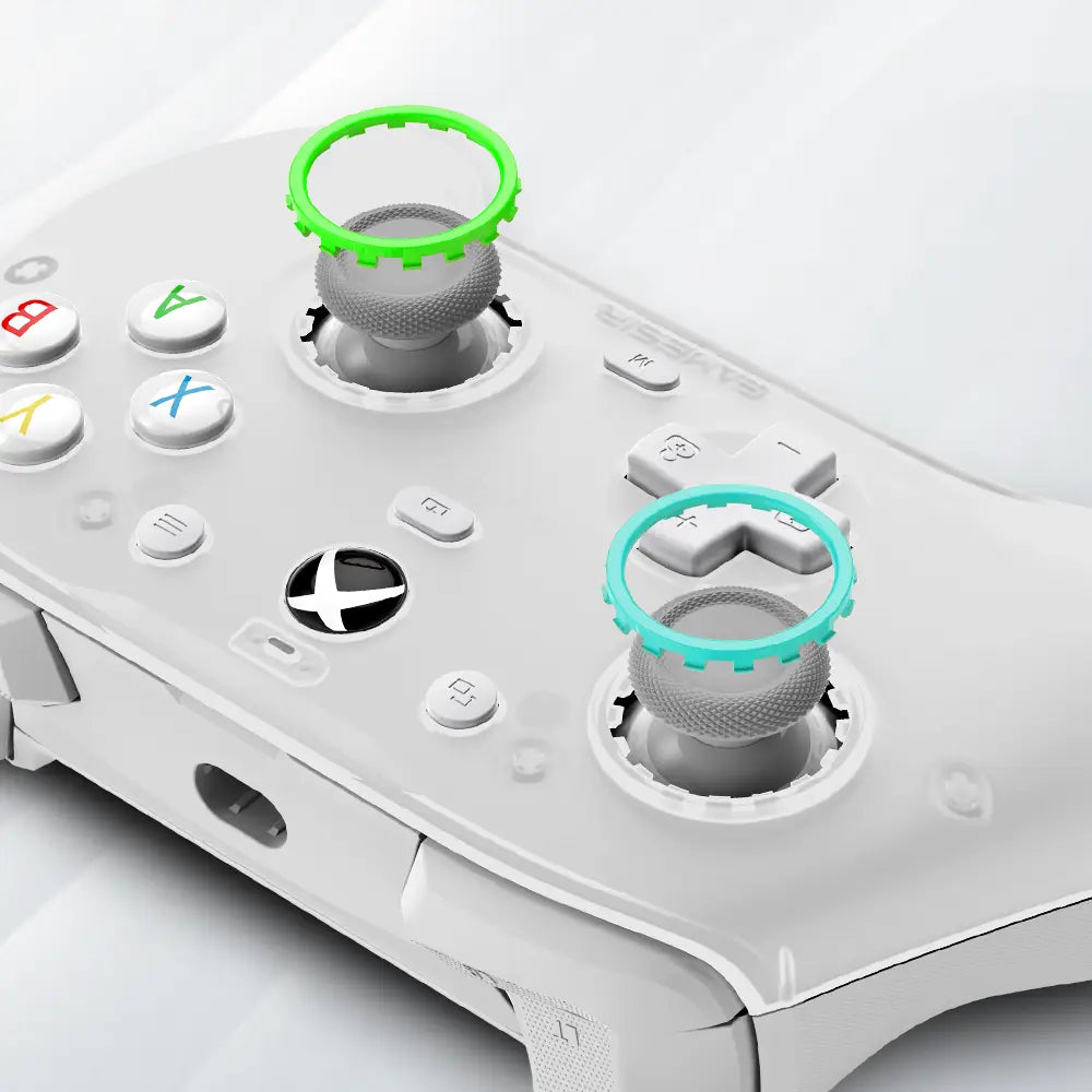 White xbox controller featuring the Gamesir G7 magnetic faceplate and accessories kit with bright green and teal-colored grip rings on the analog sticks.