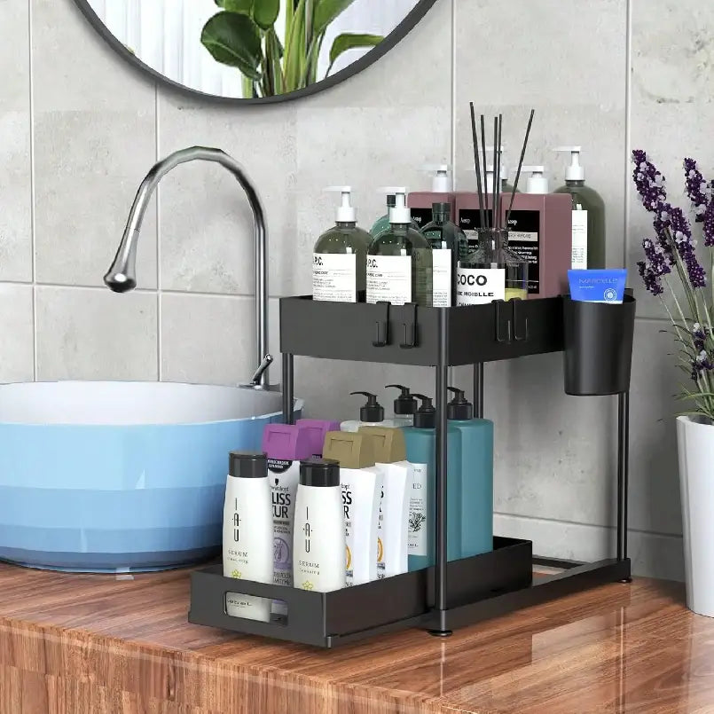 Black two-tier bpa-free plastic under sink organizer with pull-out tray and side cup holder for bathroom storage.