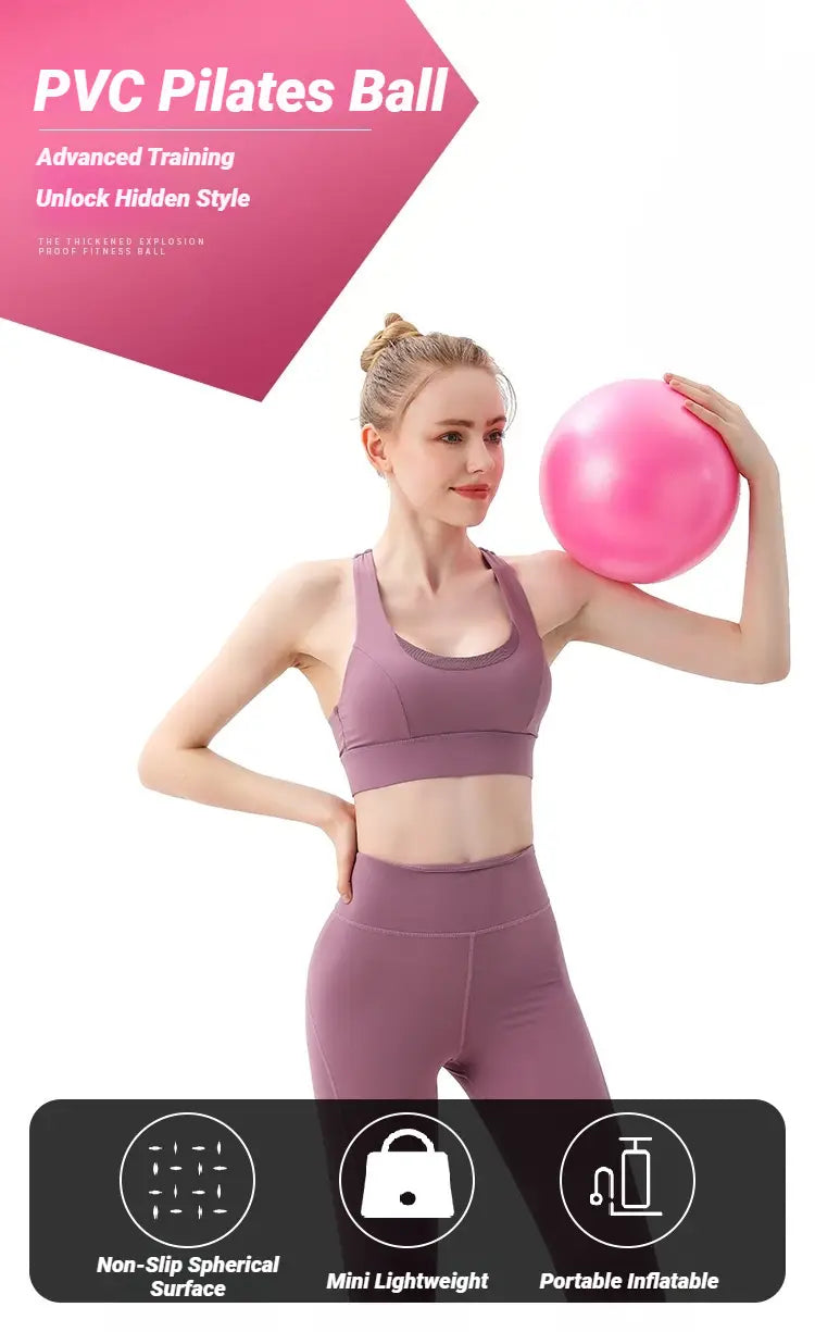Mini pilates yoga ball in pink pvc with a non-slip spherical surface designed for advanced core fitness training and portable use.