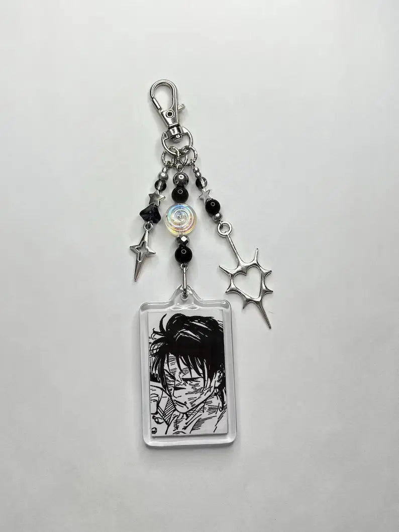 Clear acrylic rectangular charm keychain featuring a black and white anime character illustration with silver metal charms and black beads called Choso Y2k anime beaded acrylic keychain.