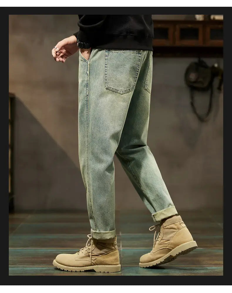 Men loose denim harem jeans in light-wash denim with a relaxed fit and cuffed hems.