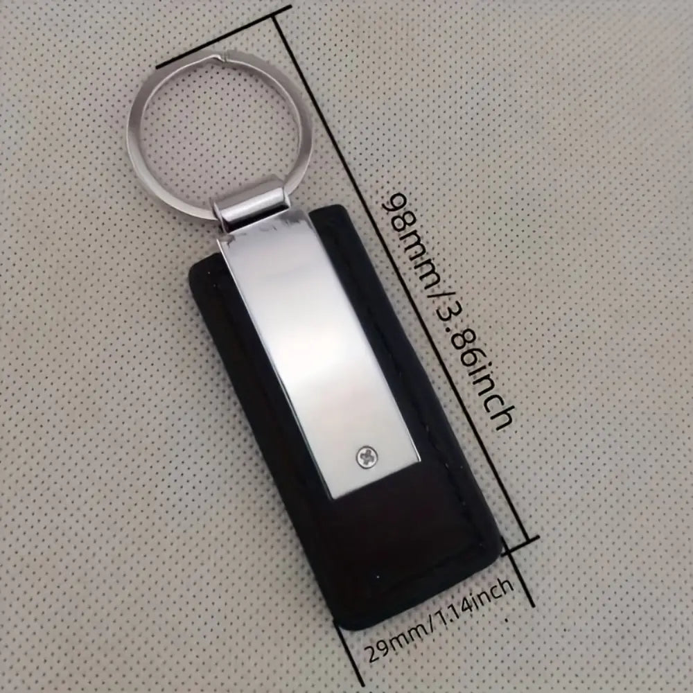 Black leather keychain with a personalized engraved stainless steel id tag and silver metal ring.