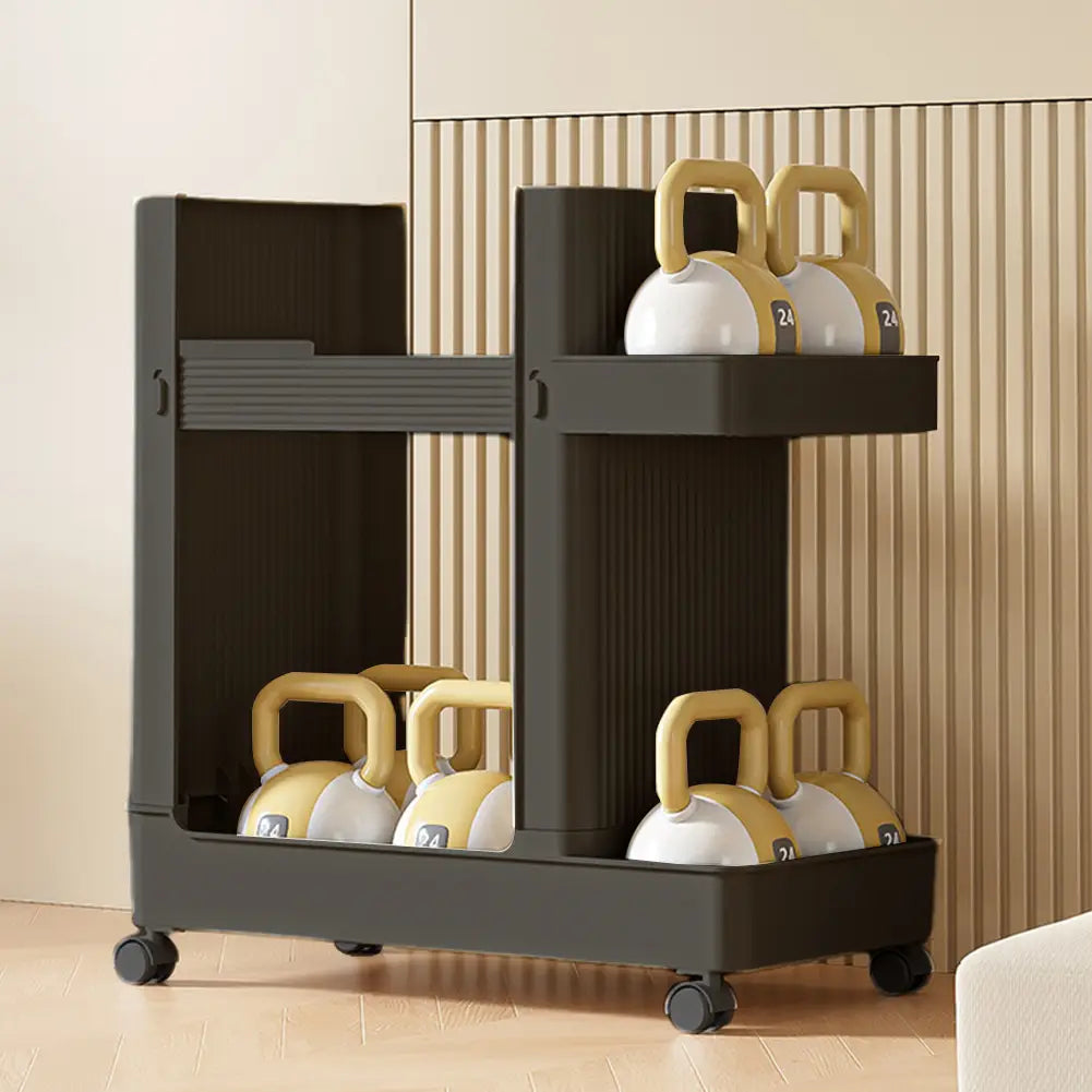Black plastic two-tier gym equipment organizer trolley with wheels featuring vertical ridged panels and open shelves holding yellow and white kettlebells.