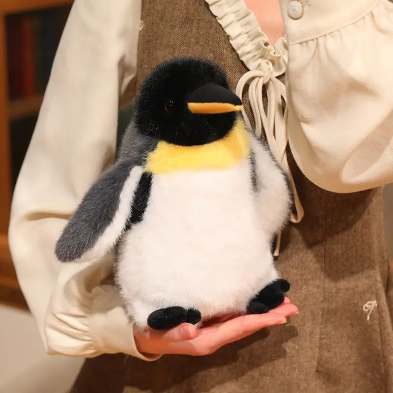 A plush penguin stuffed animal soft toy pair features black white and yellow fur with soft material.
