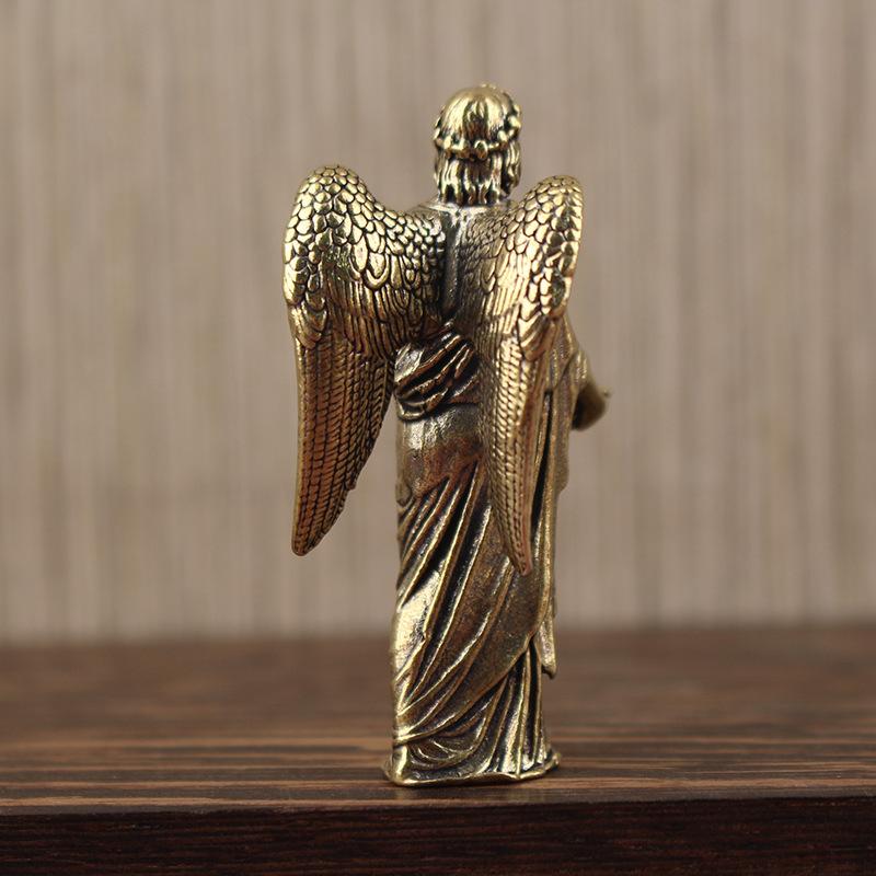 Bronze-colored golden angel figurine home decor statue with intricately detailed wings and draped robes.