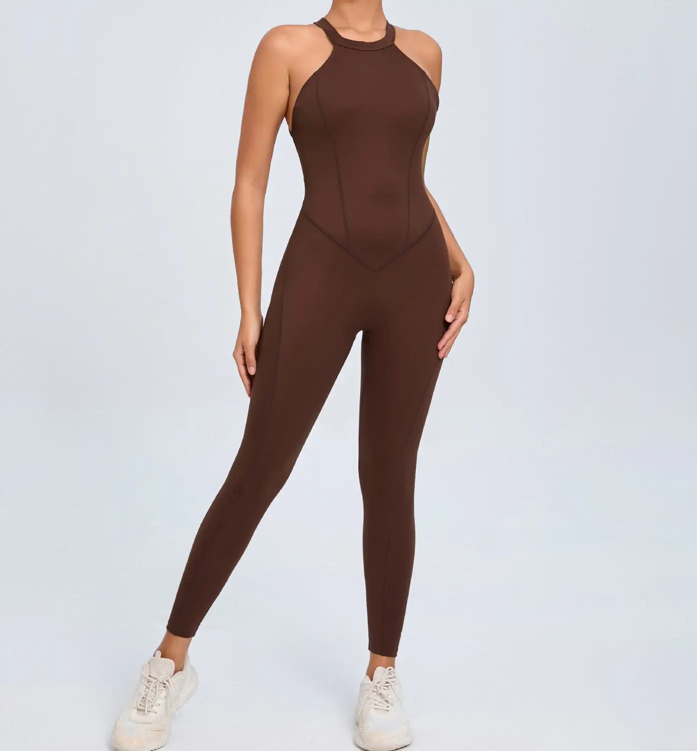 A sleek solid brown one-piece athletic jumpsuit with a halter neckline and form-fitting design for workout use.