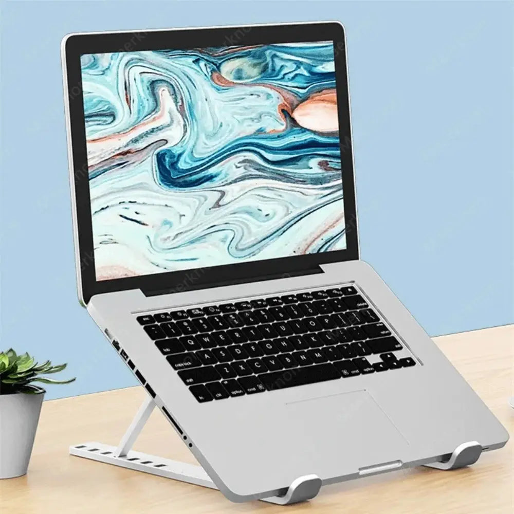 Silberner verstellbarer Kunststoff-Laptopständerhalter für Notebooks mit faltbarer Höhe und elegantem minimalistischen Design für ergonomische Nutzung