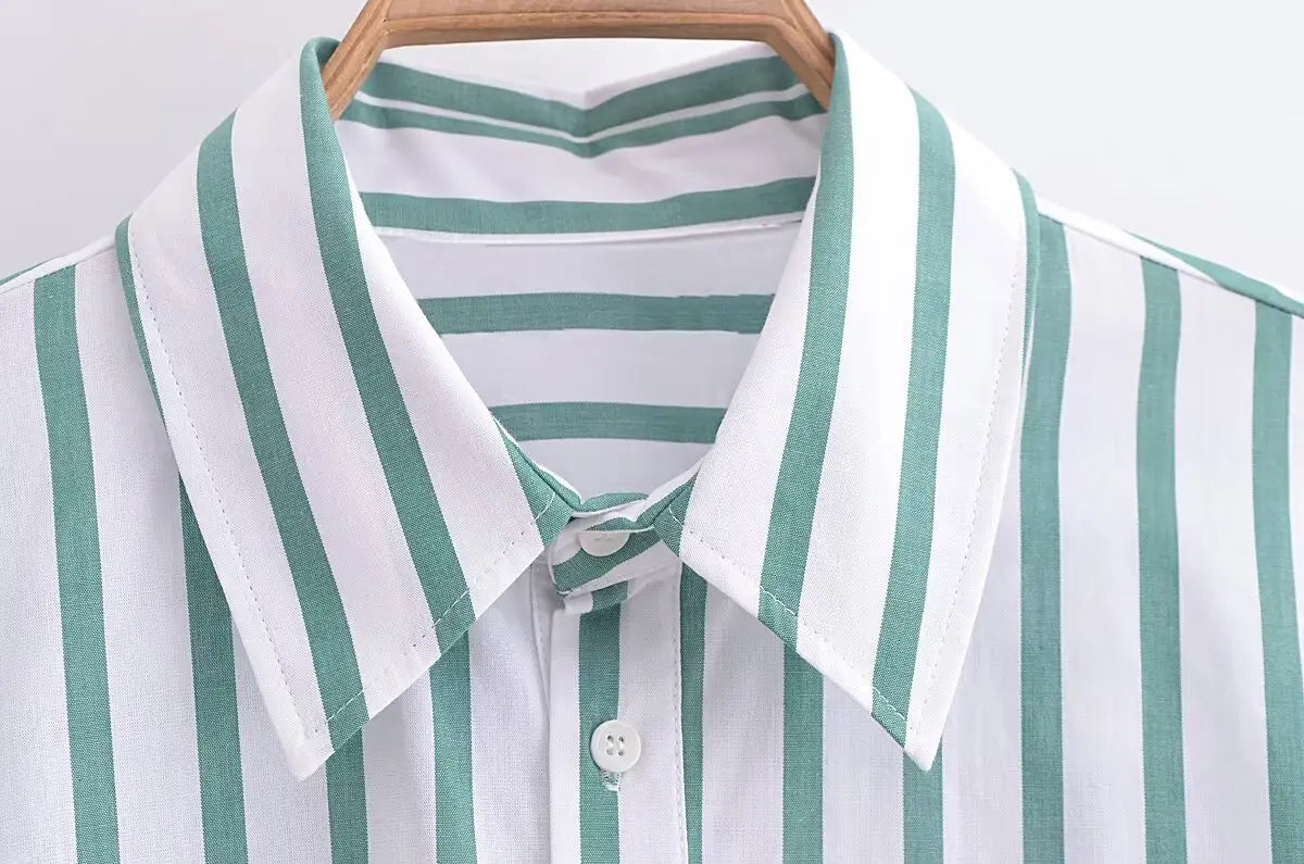 A crisp white and teal vertical striped short sleeve crop shirt with a classic collar.