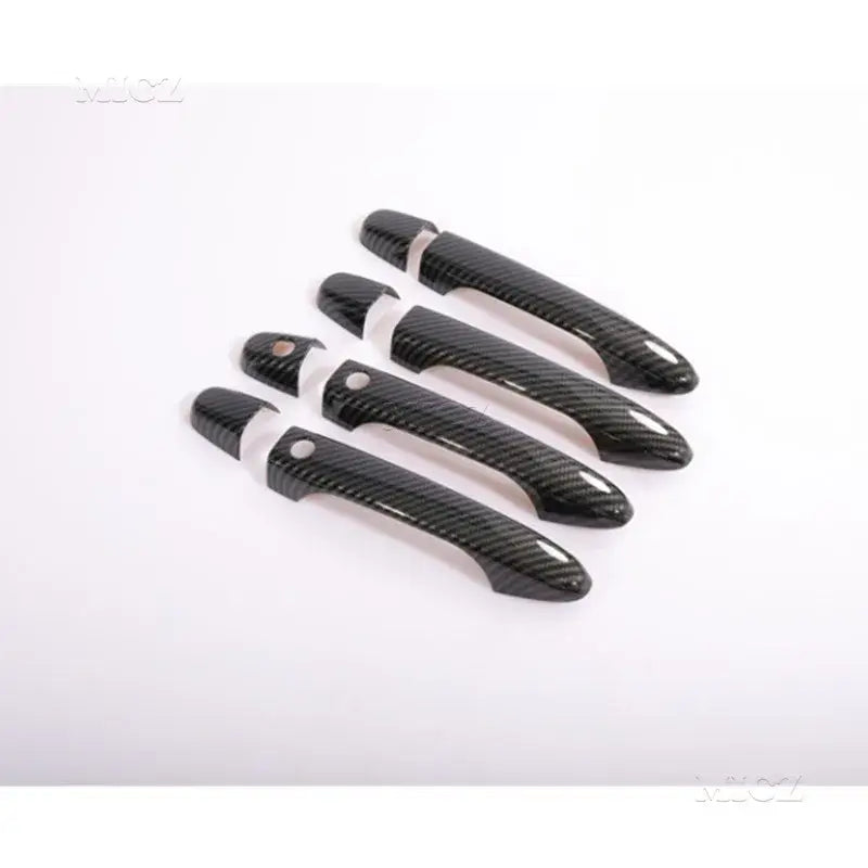 Juego de cuatro cubiertas de manijas de puerta para automóviles con textura de fibra de carbono negra para los modelos Honda Civic y CR V de 2012 a 2016.