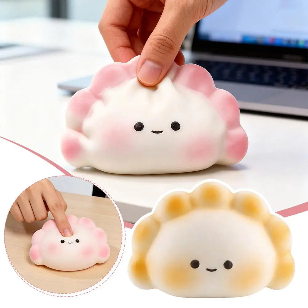 Juguete exprimible para aliviar el estrés con forma de dimsum en colores rosa y blanco, con linda carita sonriente, para aliviar la ansiedad y relajarse.