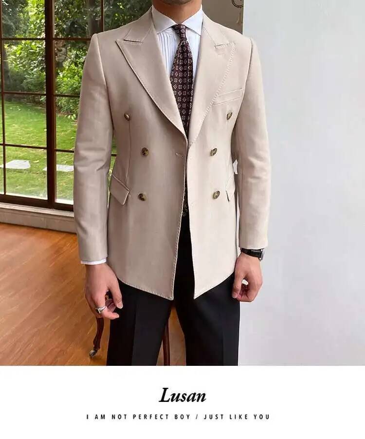 Beige double breasted slim fit blazer jacket for men featuring gold toned buttons and subtle stitching details.