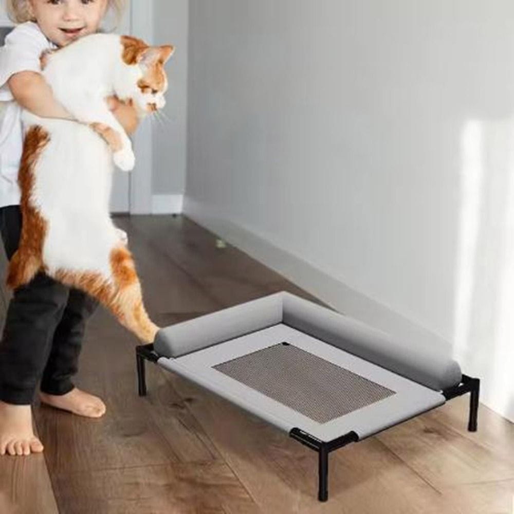 gray mesh elevated dog bed with breathable fabric and black metal frame designed as a raised pet cot for improved comfort and airflow