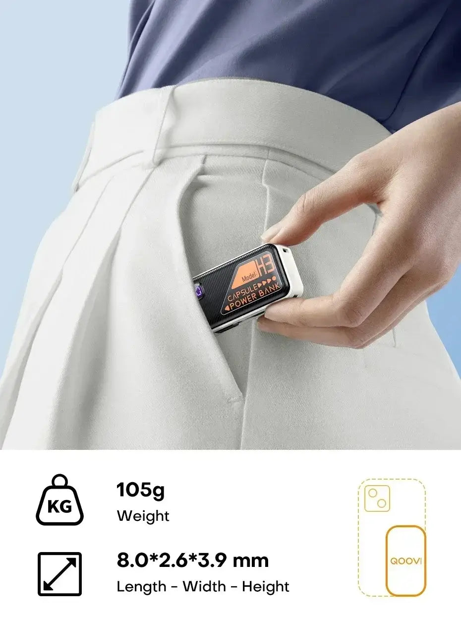 Compact black and white portable power bank with orange branding and digital display designed for fast charging and easy pocket fitting.