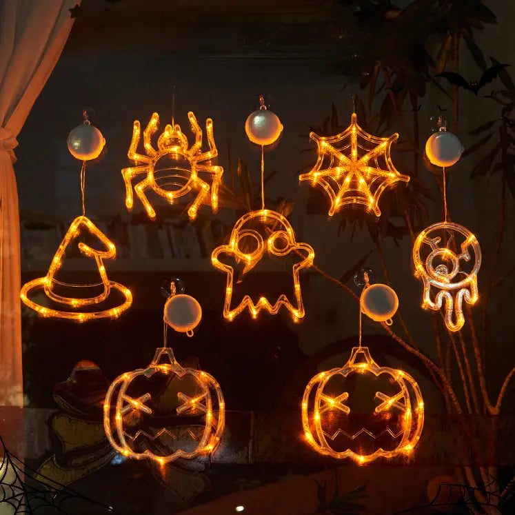 halloween window light battery operated pumpkin ghost decor featuring orange led lights shaped like spiders webs ghosts witch hats and pumpkins for festive indoor decoration.
