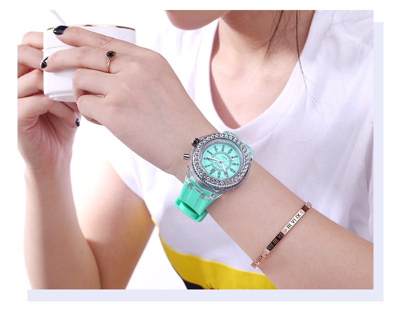 A turquoise led luminous silicone watch rhinestone digital timepiece with a sparkling silver bezel roman numeral markings and a matching silicone strap.