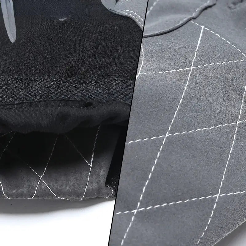 Gant de travail en cuir de vache noir, avec tissu texturé et coutures blanches, montrant le côté intérieur d’un gant de sécurité durable pour la conduite.
