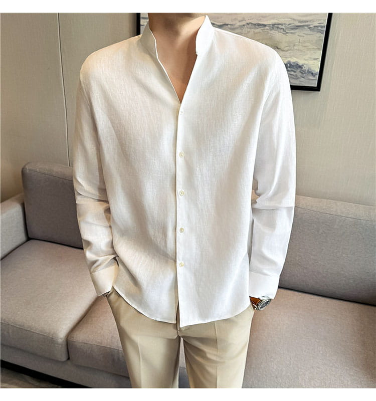 A crisp white men’s linen mandarin collar shirt featuring a long-sleeved button-up design with subtle texture.