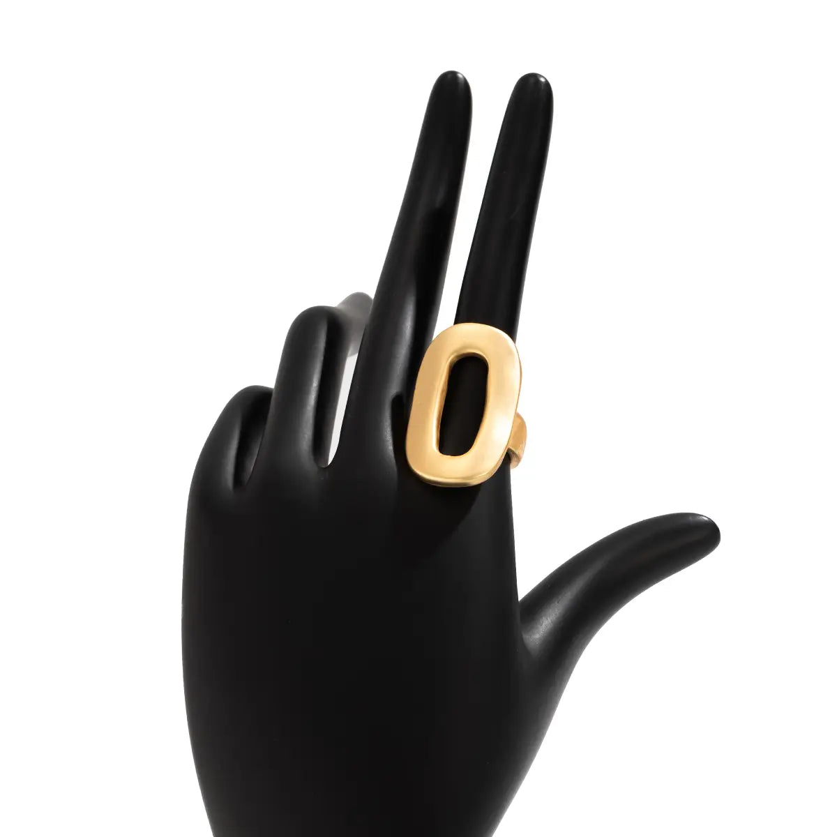 Gold-toned geometric oval open ring with a bold minimalist design displayed on a black mannequin hand for women.