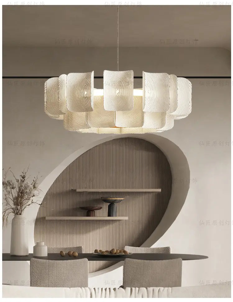 Minimalist Wabi Sabi LED chandelier pendant light featuring a modern white textured design with layered circular segments.
