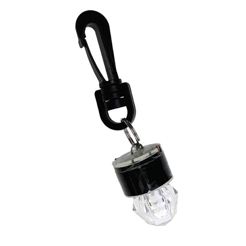 Black carabiner clip attached to a clear faceted crystal-like bulb with a black cap and metal ring in a scuba diving water activated safety LED beacon.