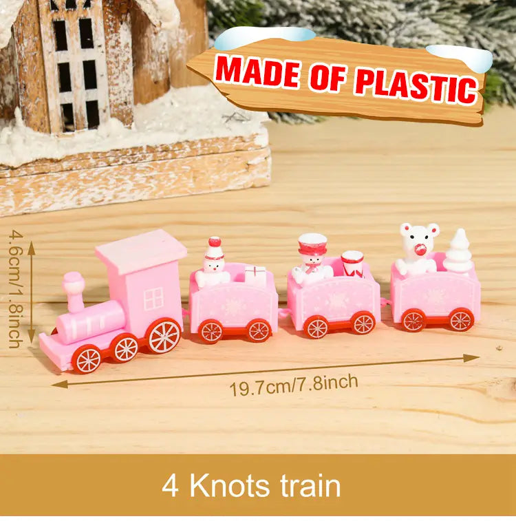 Pink wooden Christmas train toy with four carriages featuring snowman and polar bear figures and red wheels for holiday home decoration.