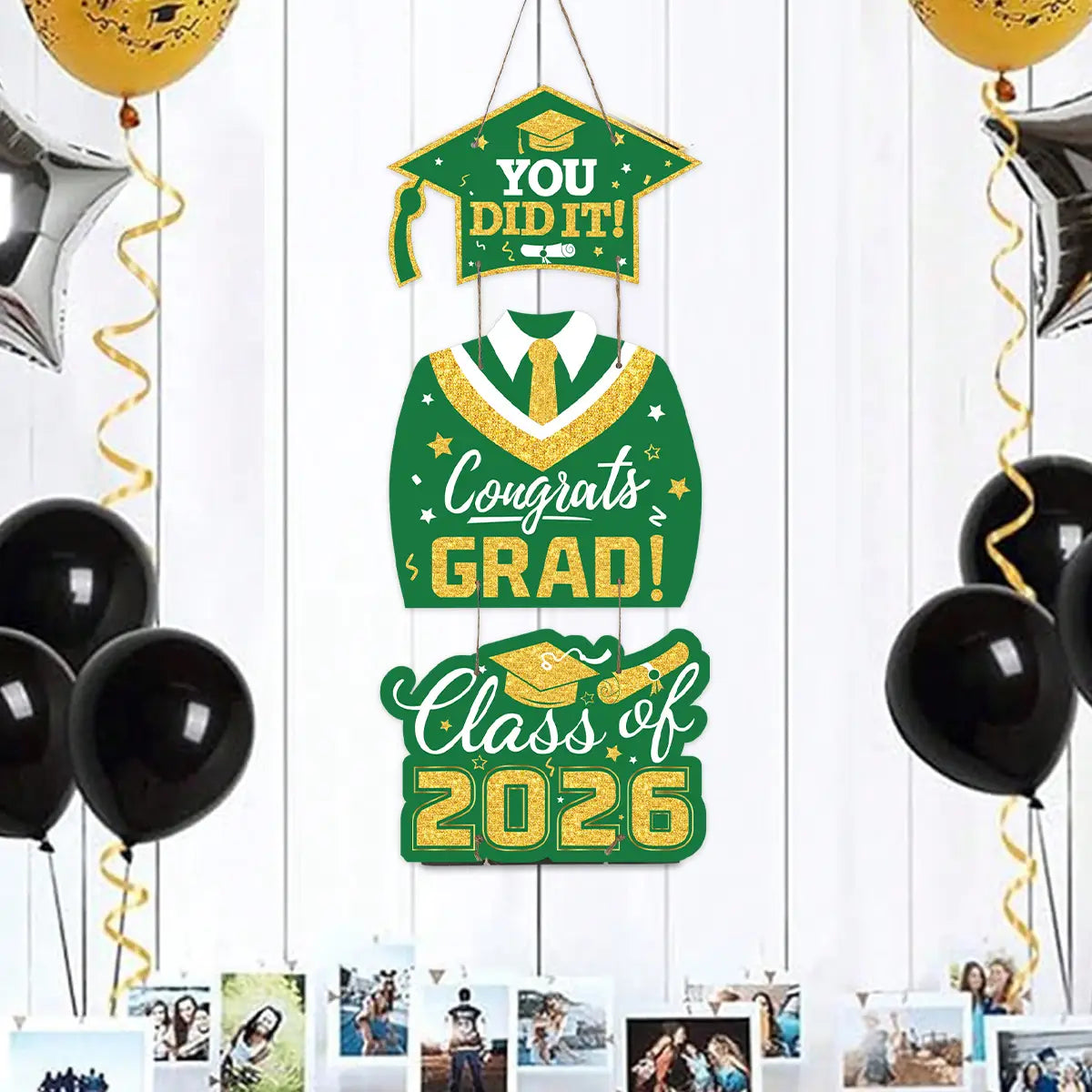 class of 2026 graduation door hanging decor featuring a green and gold glittery banner with congratulatory text and graduation-themed designs including a mortarboard gown tie and diploma.