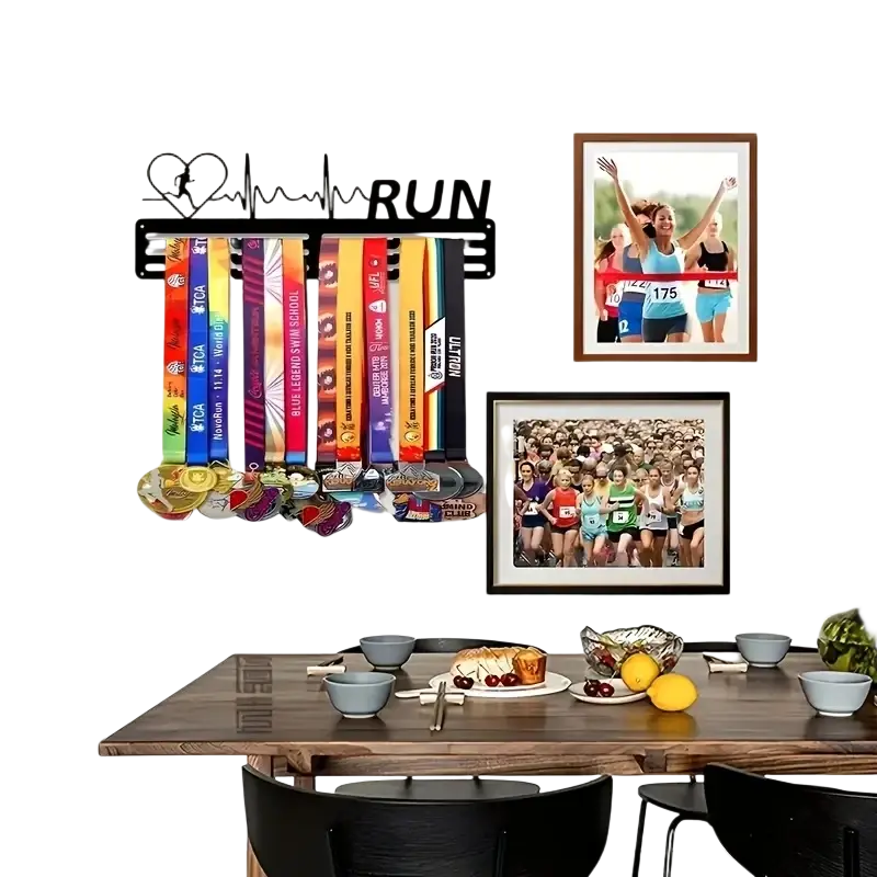 Black metal wall-mounted medal rack with heart-shaped runner silhouette and run lettering holding colorful race ribbons and medals