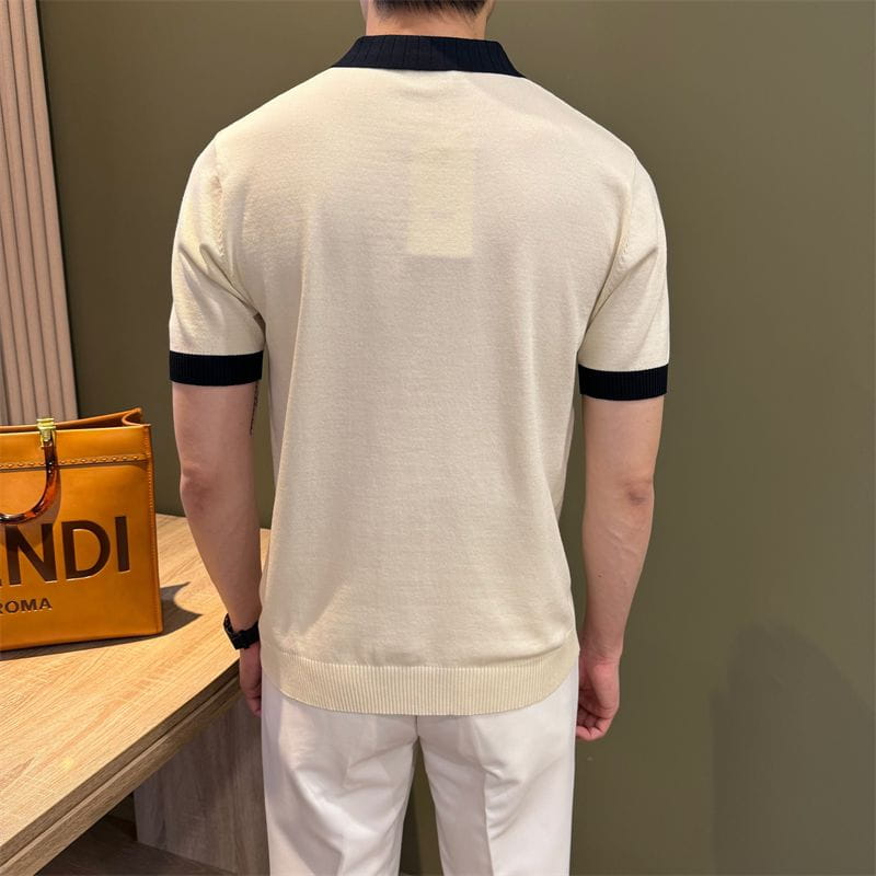 Camiseta tipo polo de punto color crema con cuello azul marino y puños de las mangas de la colección Camiseta tipo polo de punto con bloques de color.