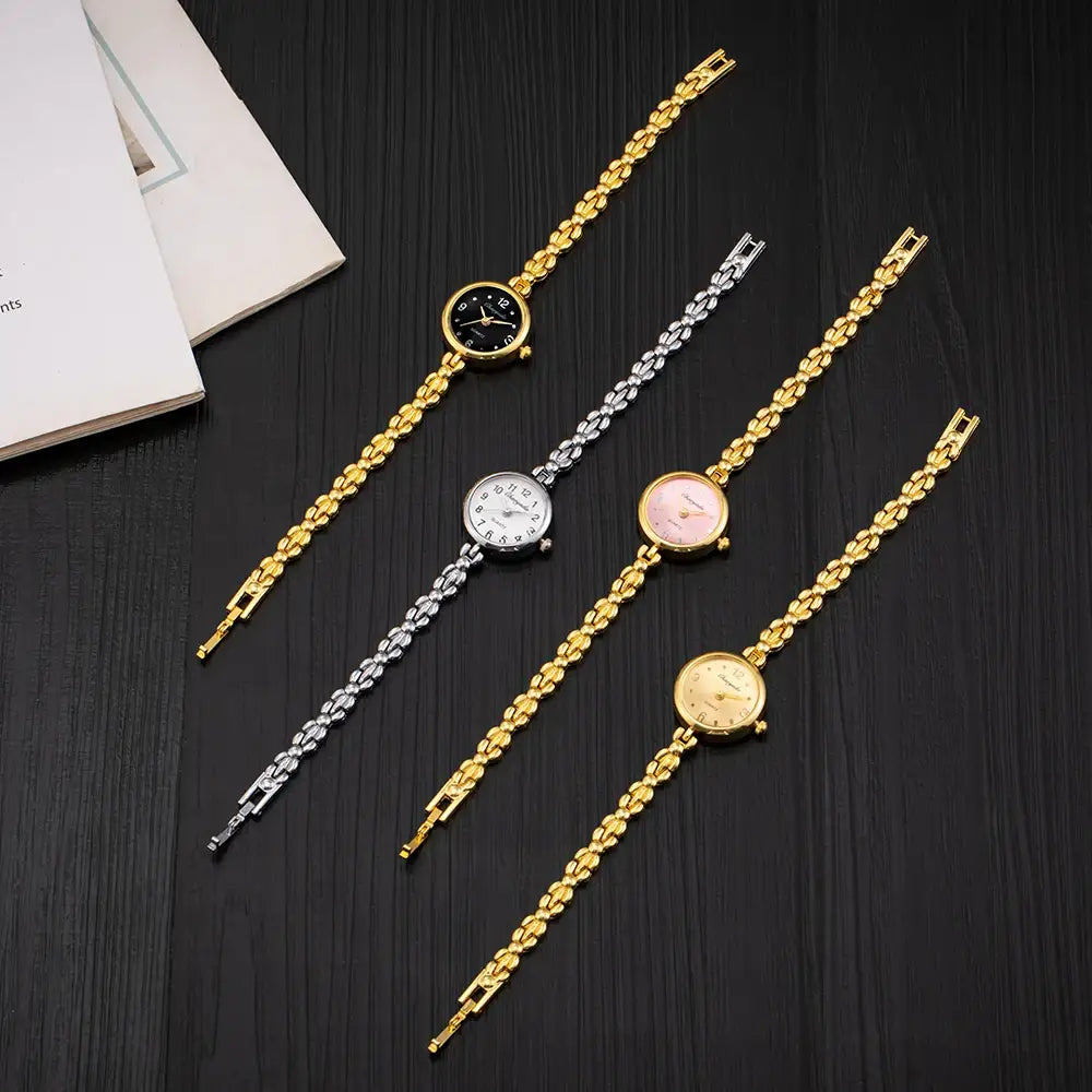 Four elegant gold and silver chain-link gold ladies bracelet watches with small round dials in black white pink and beige featuring quartz movement.
