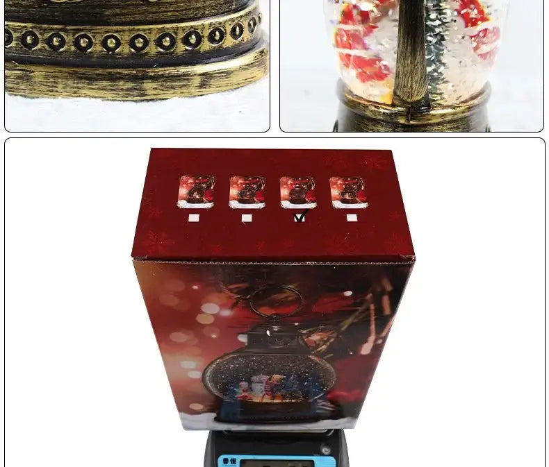 Antique brass-finished Christmas lantern snow globe music box featuring a festive scene with miniature figures and red ornaments.
