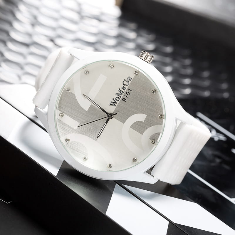 Womage silicone quartz women sports watch in white with a silver-toned dial, crystal accents at hour markers, and a matching white silicone strap.