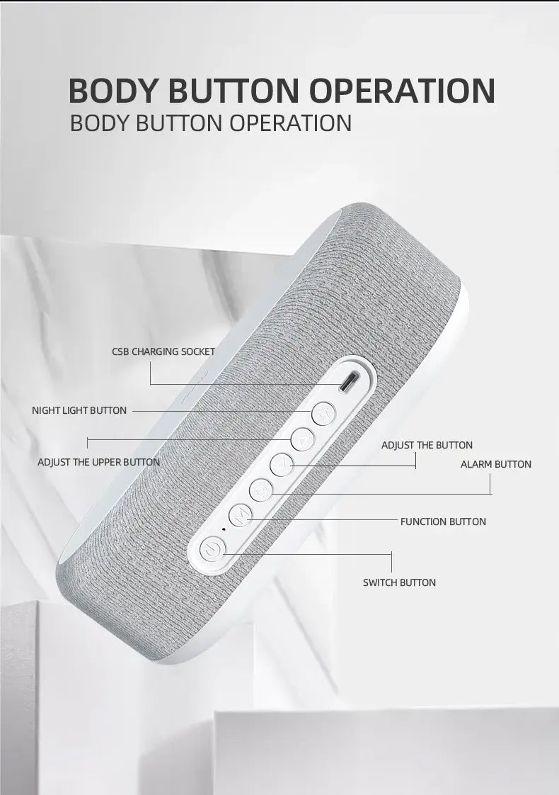 Haut-parleur Bluetooth en tissu texturé gris avec accents blancs, boutons de commande circulaires et fonction de charge sans fil pour le mode d’économie d’énergie.