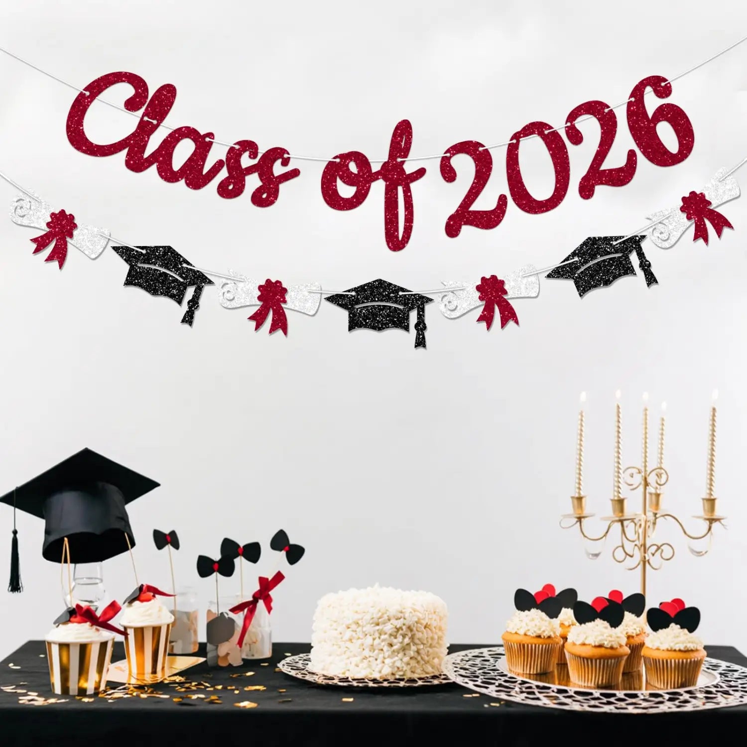 Red glitter class of 2026 graduation banner featuring black graduation caps and red bows for graduation celebrations.