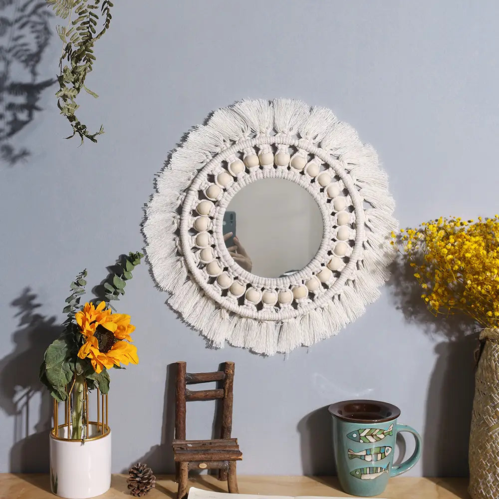 round white macrame wall mirror with fringe tassels and decorative beads as a boho decorative round mirror