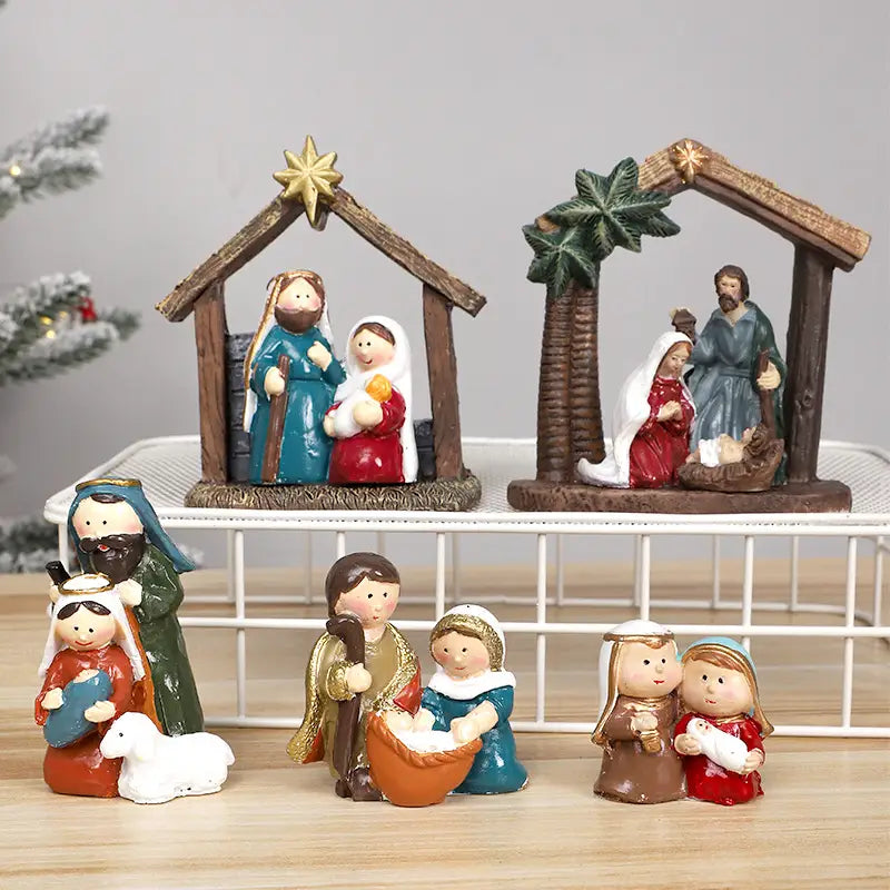 鮮やかな樹脂製の降誕の情景フィギュアのセット。精巧に描かれた顔と、クリスマステーブルの装飾用の素朴な木製の厩（うまや）デザインを備えています。
