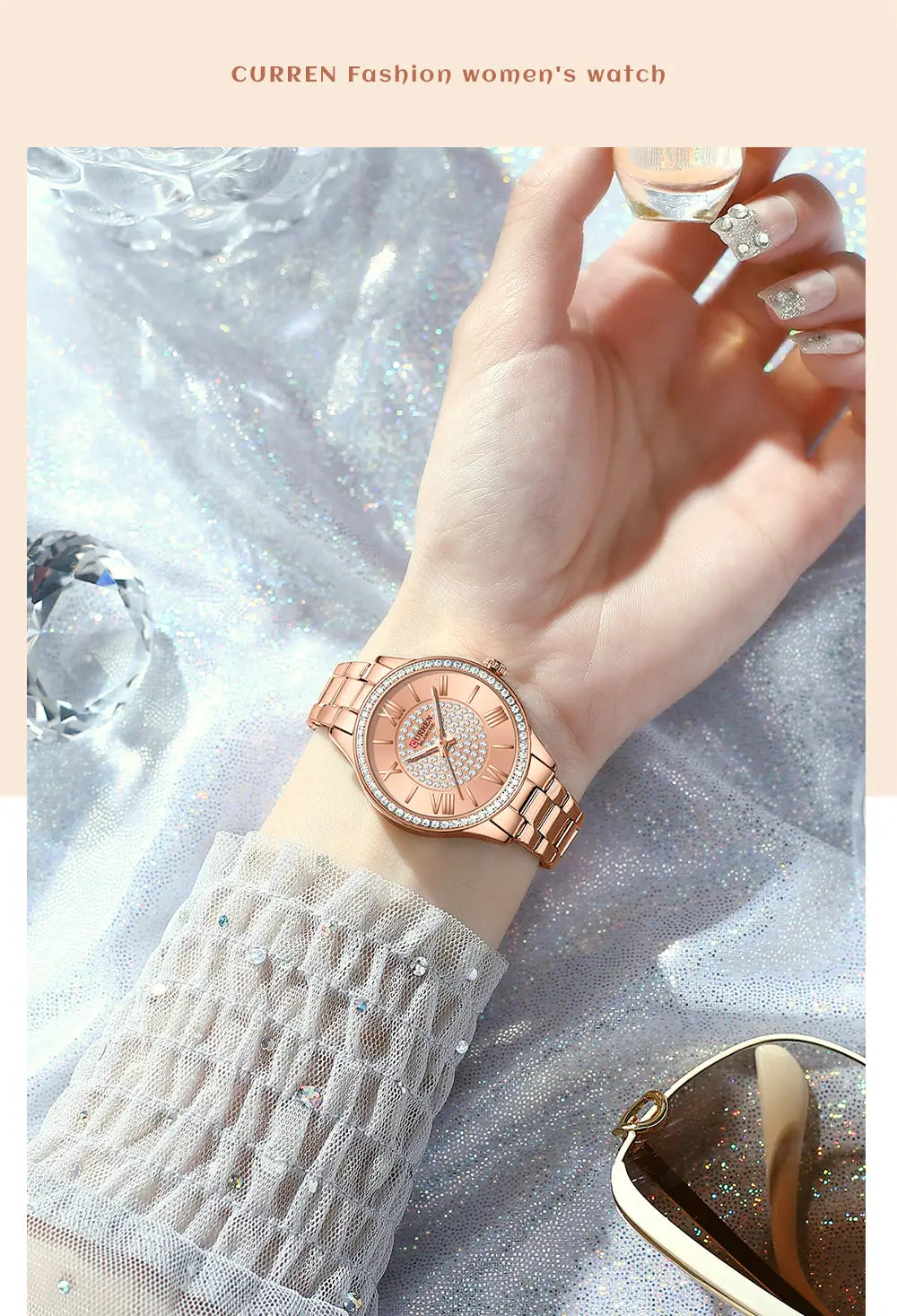 Rose gold-toned Curren women stainless steel crystal quartz watch with a sparkling diamond-studded bezel and an elegant peach-colored dial featuring roman numerals.