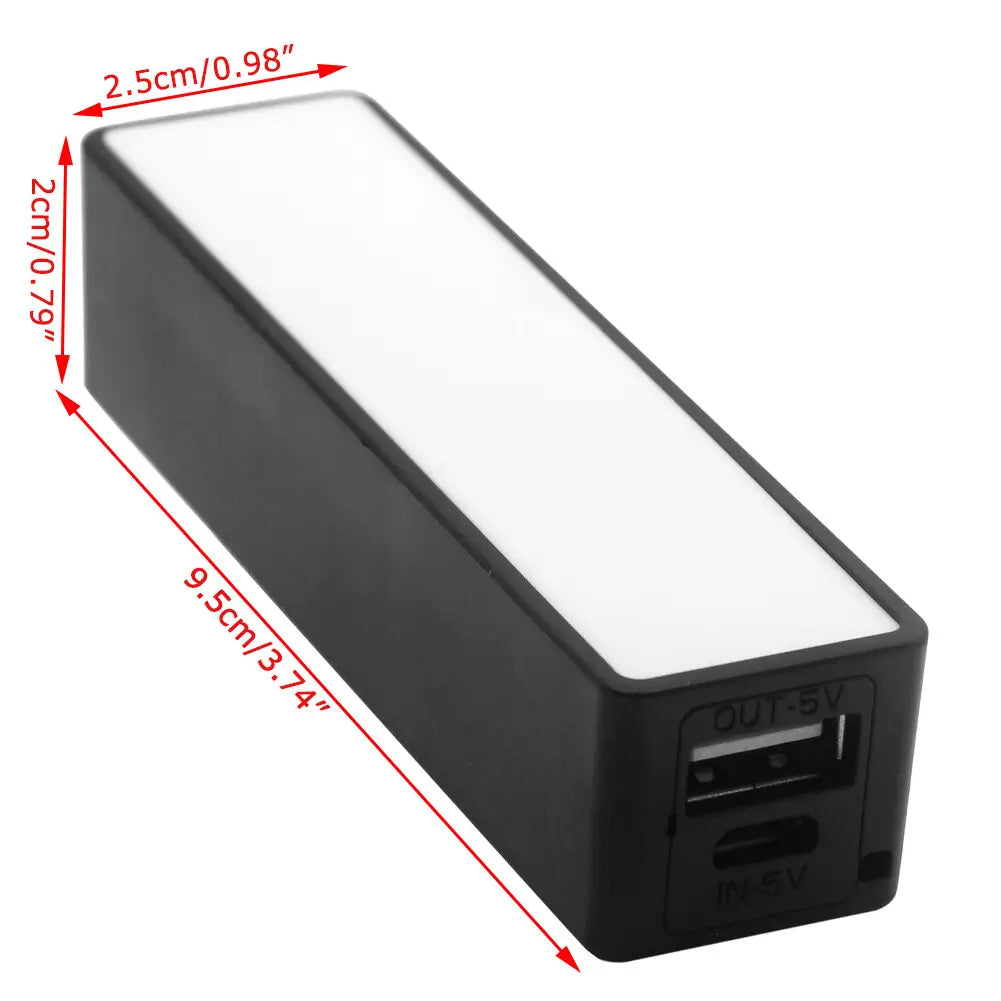 Black rectangular portable power bank with a white illuminated panel and micro usb ports designed for 18650 battery charging and portable power use.
