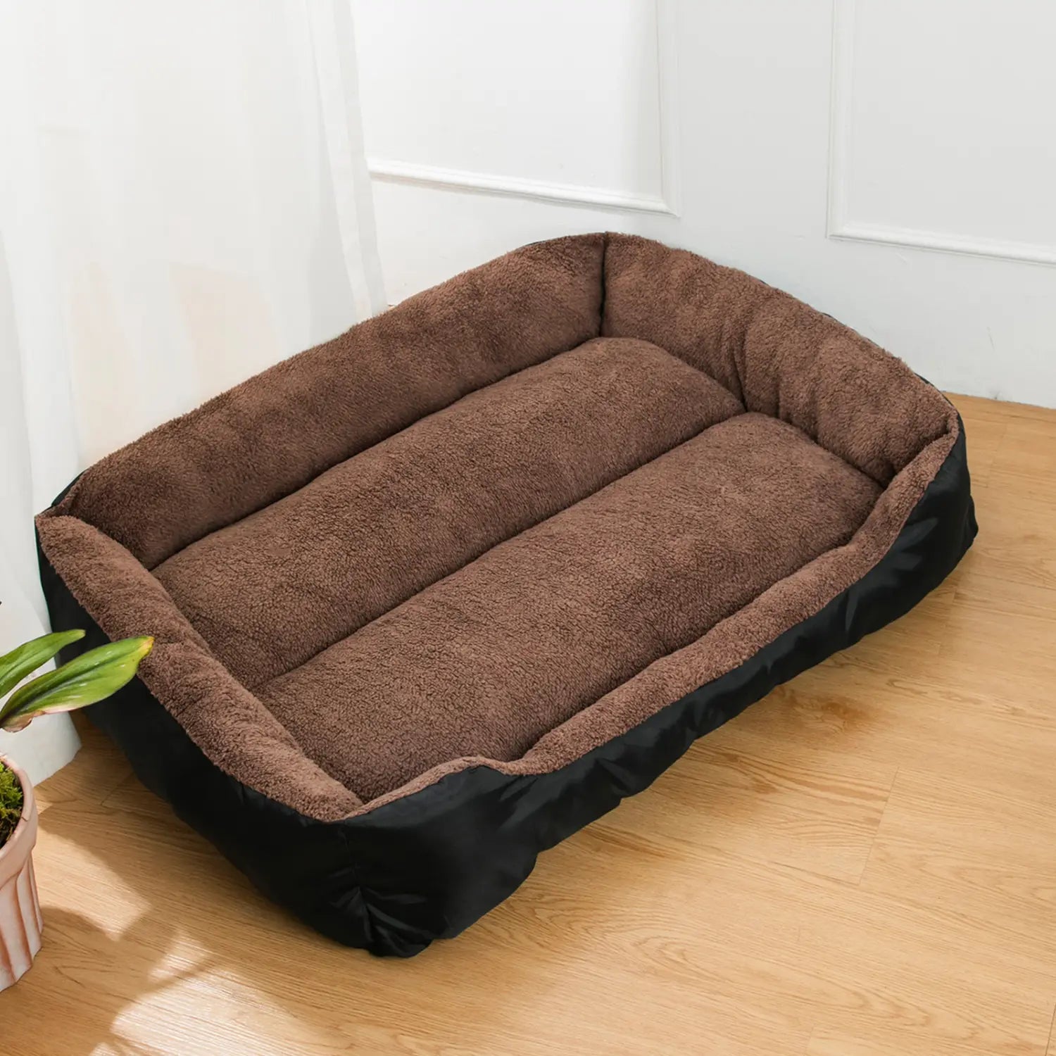 Brown plush dog bed with a black outer frame designed as a dog sofa and puppy accessories for comfortable pet resting.