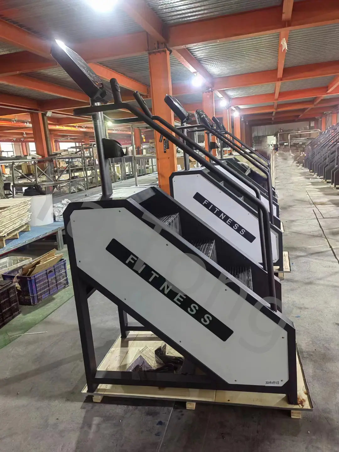 Black and white commercial stair climber machine cardio stepmill with sleek industrial design and durable construction for effective cardiovascular workouts.