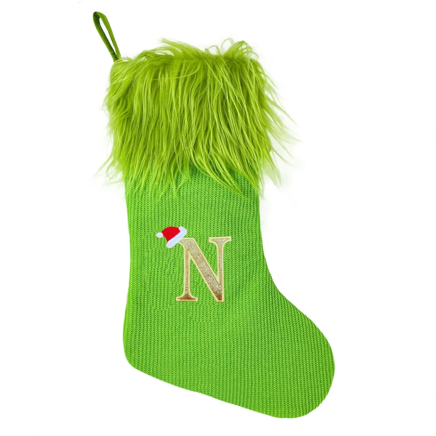 Green monogrammed Christmas stocking knitted in bright green with a fuzzy lime-green faux fur cuff and a gold glitter letter n embroidered on the front, topped with a small red Santa hat.