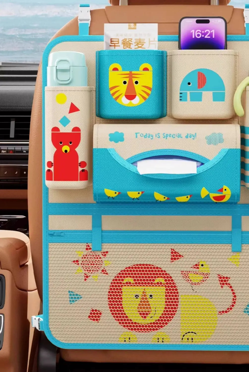 The back side of a colorful cartoon-themed car seat organizer with multiple compartments featuring animal alphabet designs and a tissue holder.