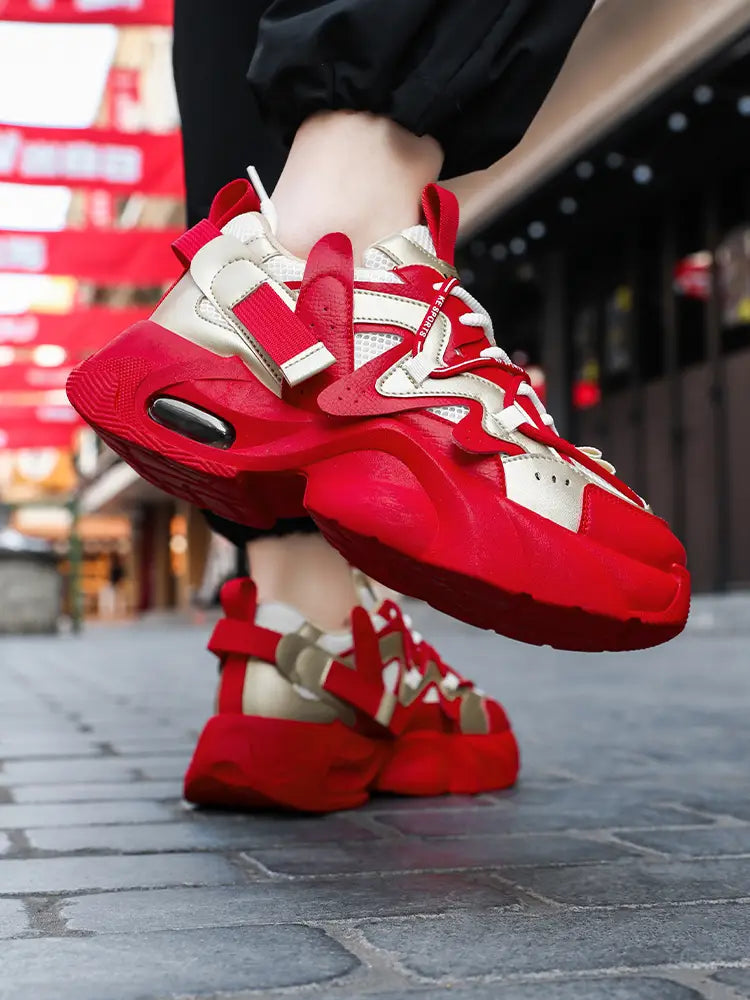 Men chunky air cushion casual sneakers in red and cream colors featuring bold red straps and a visible air cushion unit in the heel.