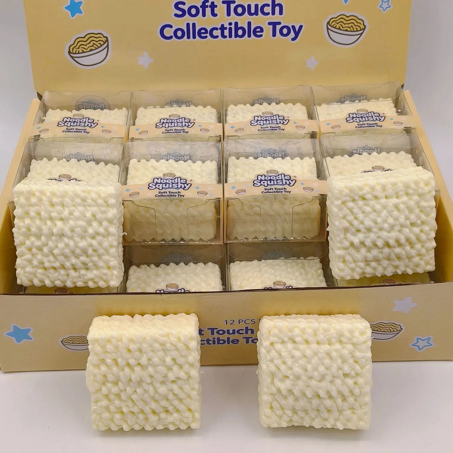 Off-white cube-shaped instant noodle squishy toy with a textured soft touch surface resembling noodles for stress relief and collectible use.
