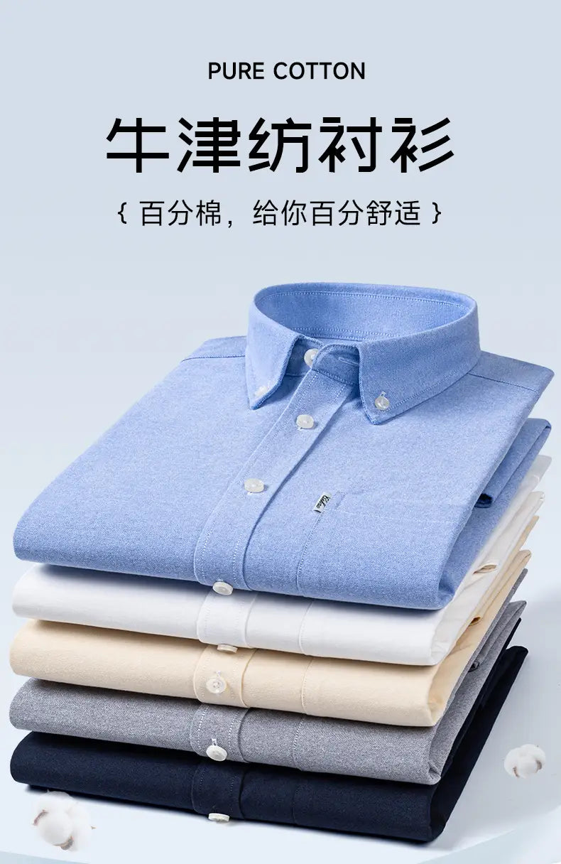 Stack of neatly folded men cotton oxford long sleeve casual shirts in pastel blue cream gray and black made from pure cotton with classic collar design.