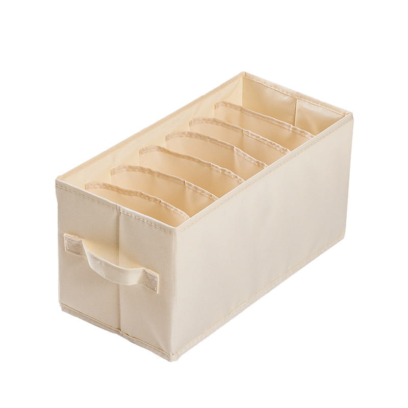 beigefarbene Stoff-Wäscheaufbewahrungsbox mit sechs Fächern und einem Griff, ausgelegt für die Aufbewahrung im Kleiderschrank und für Jeans.
