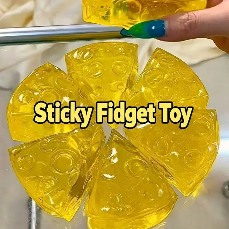 yellow translucent mini triangle cheese fidget toy pieces with circular holes made from soft material for stress relief and squeezing