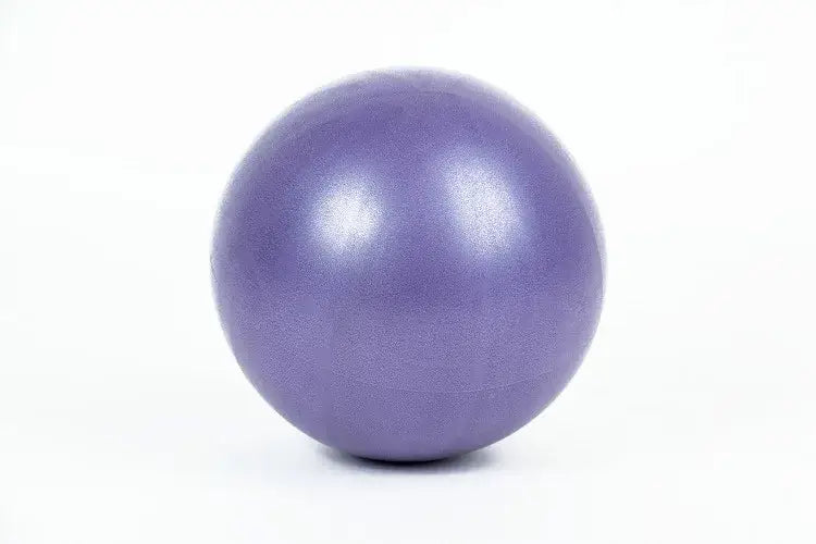 A smooth matte-finish purple anti-burst yoga ball with a slightly textured surface designed for balance training and air leakage prevention.